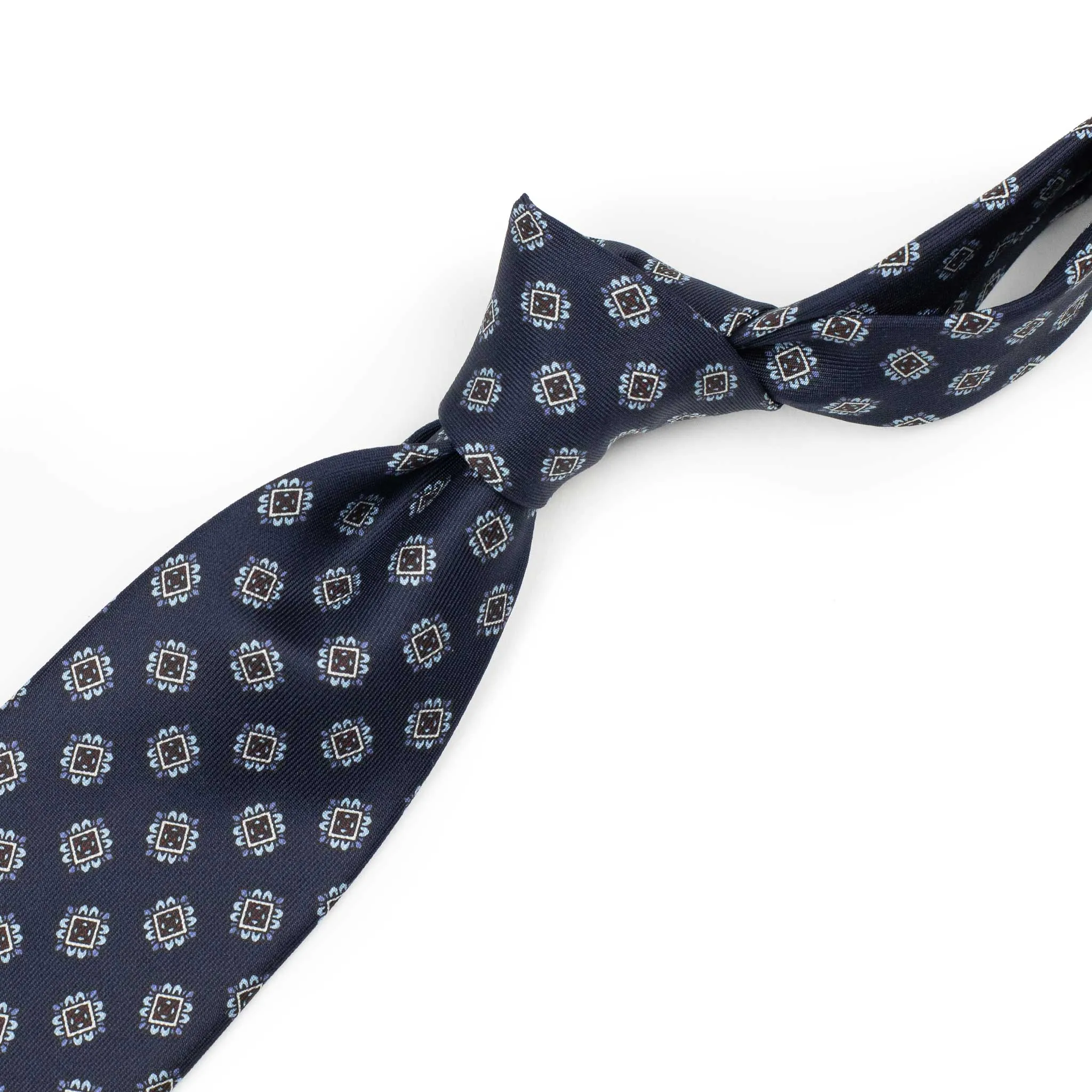 Navy blue silk tie, blue brown and white neat print